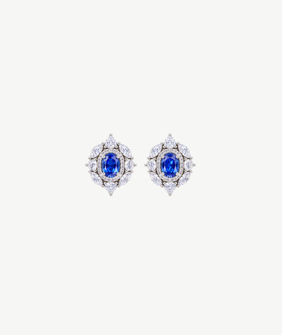 BLUE OVAL HALO SILVER EARRINGS | أقراط فضة بحجر أزرق بيضاوي